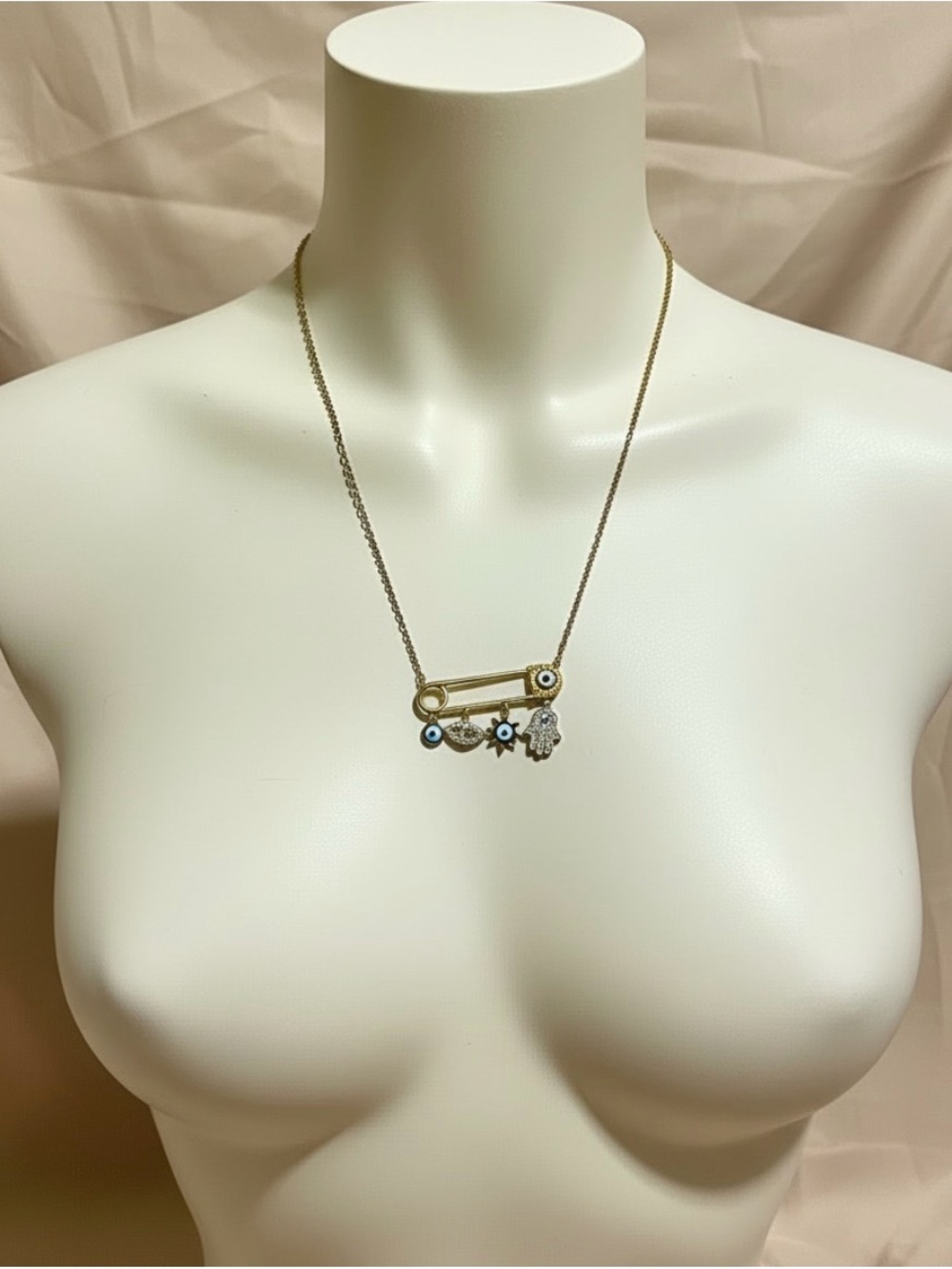 Gold-Tone Safety Pin Necklace with Blue, White and Gold Evil Eyes and a Hamsa